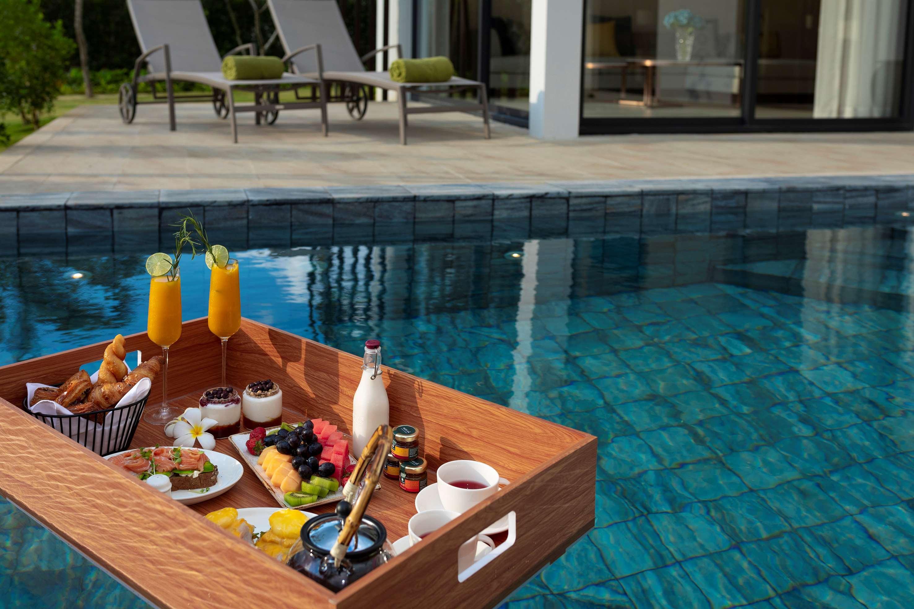 Melia Ho Tram Beach Resort Exterior photo Floating breakfast at a resort in Phuket, Thailand