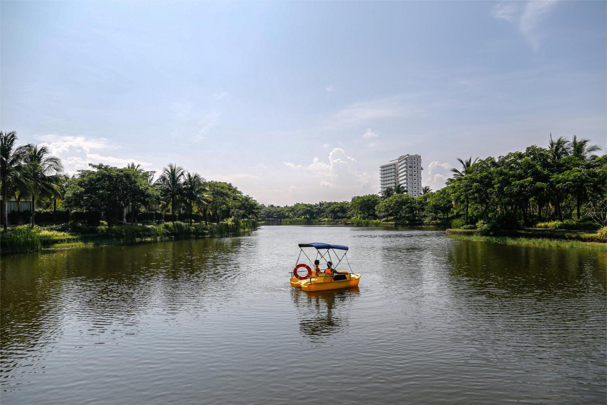 Melia Ho Tram Beach Resort Exterior photo Boating at the lake