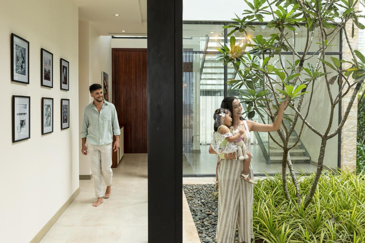 Melia Ho Tram Beach Resort Exterior photo A family at their home in Hyderabad